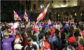  ?? Saturday night. Photograph: Anadolu/Getty Images ?? Protesters opposing the bill gathered in front of the parliament building in Tbilisi on