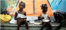 ?? | Reuters ?? MIGRANT girls from Congo eat outside their tent in Tapachula, Mexico, earlier this month. US President Donald Trump is proposing to send migrants travelling to the US to ‘sanctuary cities’.