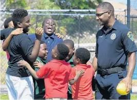  ?? JIM RASSOL/STAFF PHOTOGRAPH­ER ?? “Our job personally is to come out and show these kids we’re human,” says Boynton Beach Police Officer Terrence Paramore.