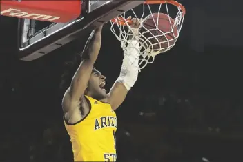  ?? ASSOCIATED PRESS ?? IN THIS FEB. 8 FILE PHOTO, Arizona State guard Remy Martin dunks against Southern California during the second half of a game in Tempe. Martin opted to return to Arizona State after testing the NBA waters.