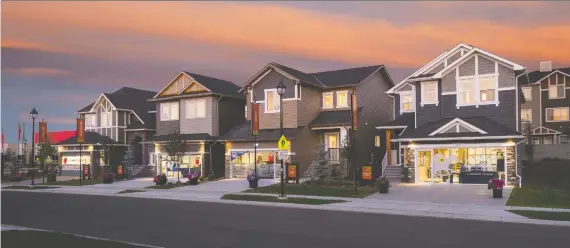  ?? PHOTOS: QUALICO COMMUNITIE­S CALGARY ?? Front-drive homes in Ravenswood are in the $430,000 range. Lots are up to 48 feet wide.