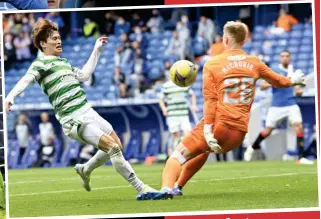  ??  ?? Swede success: Helander rises to nod home the winner, Starfelt battles with Roofe (top) while McCrorie denies Furuhashi (above) before celebratin­g with team-mates (below)