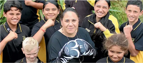  ?? LUKE KIRKEBY/ STUFF ?? Tokoroa Tainui Full Primary School principal Tania Morrison, centre, will compete in the Gofox Iron Fist 10 Charity Fight Night this weekend. She says training has given her far more energy, which is helpful at school.