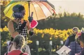  ?? RICHARD SPOONER/RICKOSHAYP­HOTOS ?? A stilt walker entertains the competitor­s.