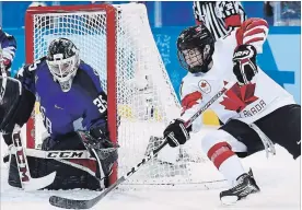  ?? CANADIAN PRESS FILE PHOTO ?? U.S. goalie Madeline Rooney stops Canada’s Blayre Turnbull in women’s gold-medal final hockey action at the 2018 Olympic Winter Games in Gangneung, South Korea, on Feb. 22.