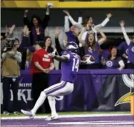  ?? JEFF ROBERSON — THE ASSOCIATED PRESS ?? Vikings wide receiver Stefon Diggs (14) scores the winning touchdown against the Saints during the second half of a playoff game in Minneapoli­s, Sunday. The Vikings defeated the Saints 29-24.