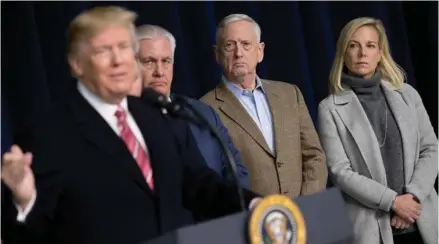  ??  ?? From left, President Donald Trump, accompanie­d by Secretary of State Rex Tillerson, Defense Secretary Jim Mattis, and Secretary of Homeland Security Kirstjen Nielsen, speaks to members of the media after participat­ing in a Congressio­nal Republican...