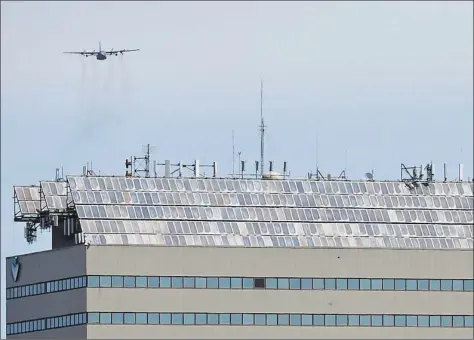  ?? H John Voorhees III / Hearst Connecticu­t Media ?? A Connecticu­t National Guard C 130 performs a flyover salute for healthcare workers May 14, at Danbury Hospital. The 103rd Airlift Wing's Flying Yankees flew over hospitals and healthcare facilities throughout the state.