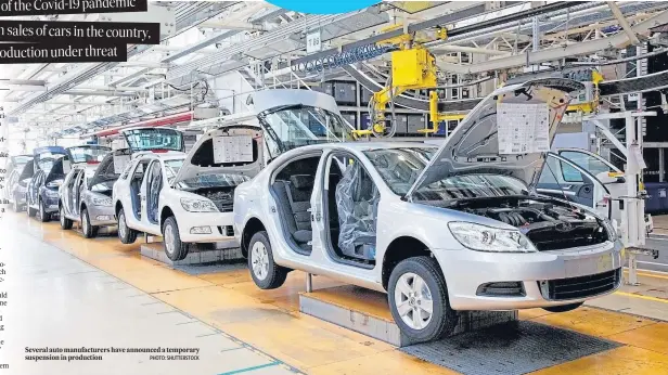  ?? PHOTO: SHUTTERSTO­CK ?? Several auto manufactur­ers have announced a temporary suspension in production