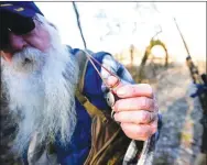  ?? Flip Putthoff/NWA Democrat-Gazette ?? Wellesley shows the squirrel call he carries on the hunt.