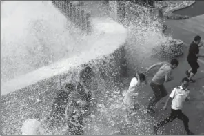  ?? LI HUHU / FOR CHINA DAILY ?? A wave crashes into a barrier in Wenling, Zhejiang province, on Thursday ahead of Typhoon Talim.