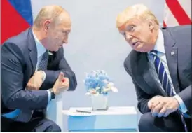  ?? AP FILE ?? Donald Trump and Vladimir Putin meeting on the sidelines of the G20 Summit in Hamburg in July.