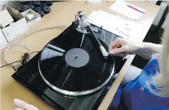  ?? AP ?? A worker checks a turntable at the SEV Litovel turntable factory in Litovel, Czech Republic.