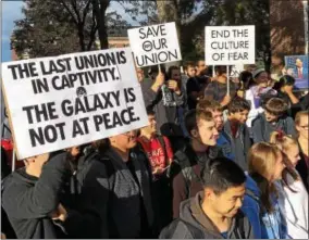  ?? RECORD FILE PHOTO ?? Sign-holding students express their outrage with administra­tors at Rensselaer Polytechni­c Institute during an Oct. 13 protest on the RPI campus in Troy.