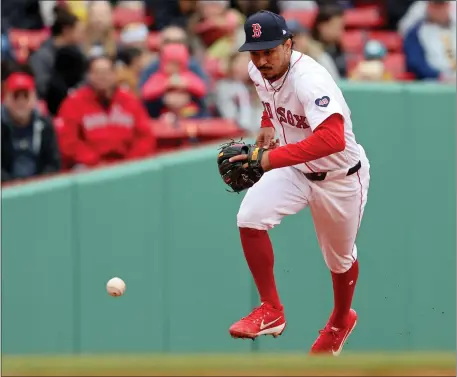  ?? MATT STONE — BOSTON HERALD ?? David Hamilton of the Boston Red Sox bobbles the ball as Gabriel Arias of the Cleveland Guardians is safe at first base during the third inning of the MLB game at Fenway Park.