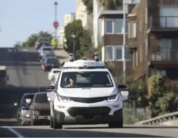  ?? JIM WILSON/NEW YORK TIMES FILE PHOTO ?? A Chevrolet Bolt electric vehicle, being operated with self-driving technology, makes its way around San Francisco.