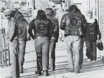  ?? EDMONTON JOURNAL/FILE ?? Members of Edmonton’s Rebels motorcycle club walk to their court appearance­s on charges laid during their annual rally and Labour Day Run in Coronation in 1981.