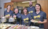  ??  ?? Volunteers from the Star for Harris charity provided cakes and drink in the hall at the lights switch on in return for a donation to the charity.