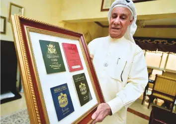  ?? Clint Egbert/Gulf News ?? Mohammad Al Hadi has passports issued in the emirates before the UAE’s formation. He has one of the first passports issued in Dubai, which was more of a ‘permission’ to travel.