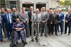  ?? AP Photo/Mary Altaffer ?? ■ Retired NYPD Detective Barbara Burnette, foreground left, who worked on the World Trade Center pile for 23 days after the terrorist attacks in 2001 is joined by her attorney Nicholas Papain, center, and former New York Gov. George Pataki, background center, and other 9/11 first responders during a news conference Wednesday in New York.