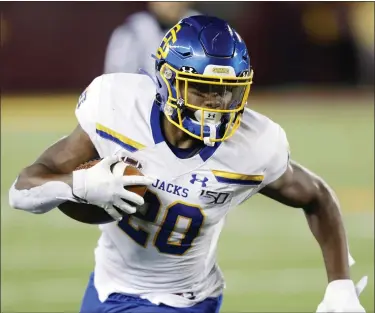  ?? AP FILE ?? South Dakota State running back Pierre Strong runs with the ball during a game against Minnesota in 2019.