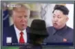  ?? AHN YOUNG-JOON — ASSOCIATED PRESS FILE PHOTO ?? On Aug. 10, a man watches a TV screen showing U.S. President Donald Trump and North Korean leader Kim Jong Un, right, during a news program at the Seoul Train Station in Seoul, South Korea.