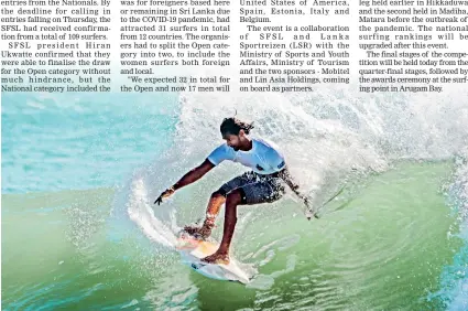  ??  ?? Kavindu Tharaka surfs the waves in Arugam Bay as surfing returns to eastern coast following the COVID enforced long break. Pic by Inna Rabotyagin­a