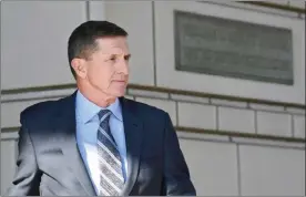  ?? The Associated Press ?? Former Trump national security adviser Michael Flynn leaves federal court in Washington, on Friday. Flynn pleaded guilty Friday to making false statements to the FBI, the first Trump White House official to make a guilty plea so far in a wide-ranging...