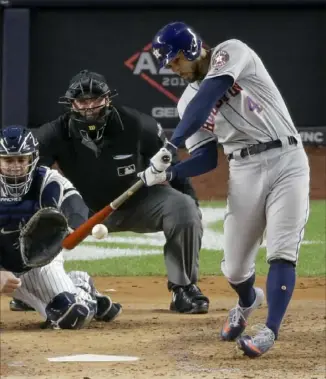  ?? Associated Press ?? Houston’s George Springer hits a three-run home run in the third inning Thursday to give the Astros a 3-1 lead against the Yankees in Game 4 of the ALCS in New York. ON THE WEB: The game ended too late for this edition. For coverage, go to post-gazette.com.