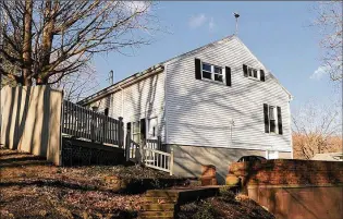  ?? ?? The 1.77-acre property has woods and a natural spring as well as a fenced back yard, two wooden decks, a terrace garden with stepping stones and a brick patio surrounded by a brick privacy wall.