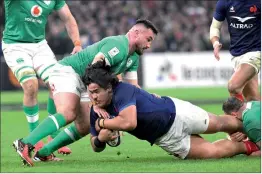  ?? — AFP photo ?? France’s lock Posolo Tuilagi is tackled by Ireland’s hooker Ronan Kelleher (left) as he runs with the ball during the Six Nations internatio­nal rugby union match between France and Ireland.