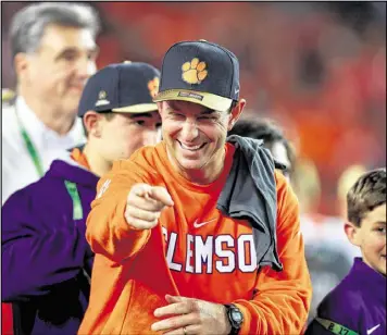  ?? TOM PENNINGTON / GETTY IMAGES ?? After the national championsh­ip victory over Alabama, Clemson coach Dabo Swinney entered offseason drills facing many questions, but he remains upbeat. Of the QB job, Swinney says, “These things work themselves out.”