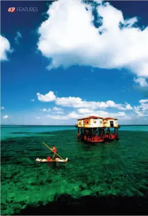  ??  ?? Stilted houses inhabited by Chinese soldiers guarding Dongmen Reef of China’s Nansha Islands, March 1998. by Niu Zhijun/cfb 1988: Chinese scientists conduct a satellite positionin­g survey of reefs and waters near Xinyi Shoal of China’s Nansha Islands....