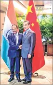  ?? PTI ?? National Security Adviser Ajit Doval shakes hands with Chinese foreign minister Wang Yi ahead of India-China Border talks at Dujiangyan city in Sichuan province of China on Saturday