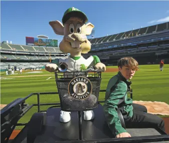  ?? Ben Margot / Associated Press ?? A’s mascot Harvey the Rabbit, one of former owner Charlie Finley’s marketing gimmicks, returned to the Coliseum on a cart in the opening series against the Angels.