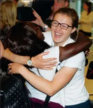  ??  ?? GREAT TIMES: White and Eni Aluko hug each other goodbye as they arrive back from the World Cup