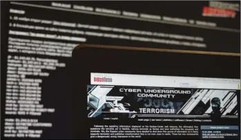  ??  ?? Archived versions of two Russian anti-terrorism websites on a computer screen are photograph­ed, in Paris on July 24. The now-defunct websites were the brainchild of alleged hacker Pyotr Levashov, according to Andrei Soldatov, an expert on the Russian...