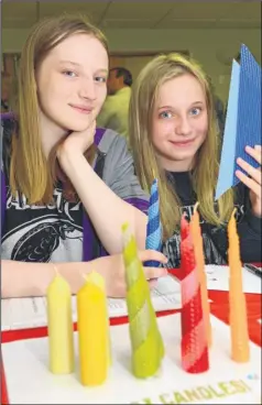  ?? Pictures: Gary Browne FM3998756 ?? Annie and Emilia Furlong-Muir making Beeswax candles