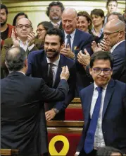  ?? MANU FERNANDEZ / AP ?? Catalonia’s new parliament elected Roger Torrent (center), a lawmaker with the left-republican ERC party, to head the assembly’s governing committee, which plays a key role in deciding what issues are debated.