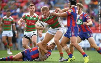  ??  ?? BAD BUNNY: George Burgess of the Rabbitohs is tackled by the Knights last weekend.