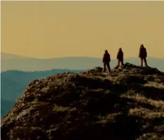  ?? SUNDANCE INSTITUTE/SQUARE PEG ?? Justice Smith and Brigette Lundy-Paine in “I Saw the TV Glow.” Right: a scene from “Sasquatch Sunset.”