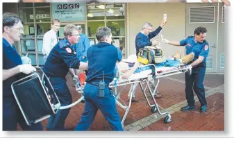  ??  ?? “I’VE BEEN WAITING MANY YEARS FOR THIS TO HAPPEN”: Ricky Balcombe (above) and his mother Christine Loader (top). The devastatin­g scene in the Little Malop St mall in 1995 (above right). Paramedics attend to Ricky after the stabbing (right). INSETS:...