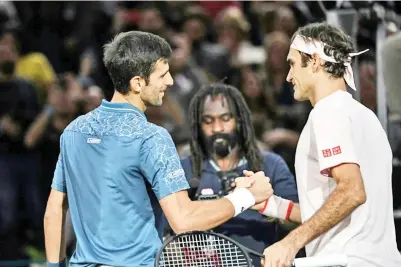  ??  ?? Friendly rivals: Novak Djokovic and Roger Federer. - AFP photo