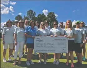  ?? Contribute­d Photo ?? Shootout: Camp Fire El Dorado received $25,000 as the beneficiar­y of the 2018 Murphy USA El Dorado Shootout. Pictured Left to Right in front row: Jennifer Reames, Brandi Connor, Leanne Harrell – Executive Director, Patti Simpson, Amber Murphy, Christy Wilson – Board President, Teresa Walthall. Back row: Becky McLelland, Thad Mason, Lindsey Kennebeck, Carol Felton, Tiffney Hughes, Nichole Nelson.