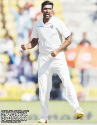  ?? India’s Ravichandr­an Ashwin celebrates the dismissal of Sri Lanka’s Dilruwan Perera (unseen) during the fourth day of their second Test in Nagpur on Monday. ??