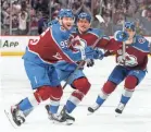  ?? BRUCE BENNETT/GETTY IMAGES ?? Andre Burakovsky celebrates with teammates after lifting the Avalanche to victory in Game 1 of the Stanley Cup Final.