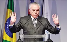  ??  ?? Temer delivers a speech during the opening ceremony of the National Car Dealers’ Federation (FENABRAVE) fair, in Sao Paulo, Brazil. — AFP photo