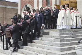  ?? CP PHOTO ?? Anne Marie D’amico’s casket is followed by family members after her funeral service in Toronto on Wednesday.
