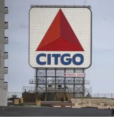  ?? NICOLAUS CZARNECKI / HERALD STAFF FILE ?? POWER PLAY: The Trump administra­tion is moving to help transfer control of Citgo, whose sign is seen above near Fenway Park and is a wholly owned subsidiary of Venezuelan state-owned oil company Petroleos de Venezuela SA, to Juan Guaido, the National Assembly leader recognized by the U.S. and other countries as Venezuela’s legitimate president, seen at left.