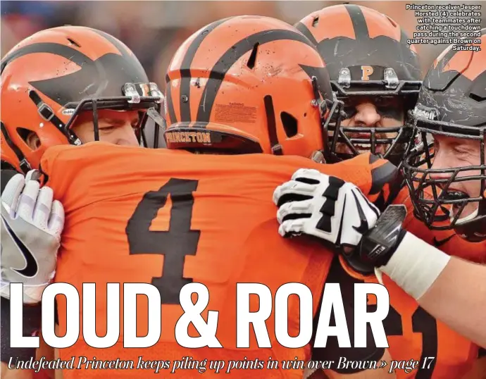  ?? KYLE FRANKO — TRENTONIAN PHOTO ?? Princeton receiver Jesper Horsted (4) celebrates with teammates after catching a touchdown pass during the second quarter against Brown on Saturday.